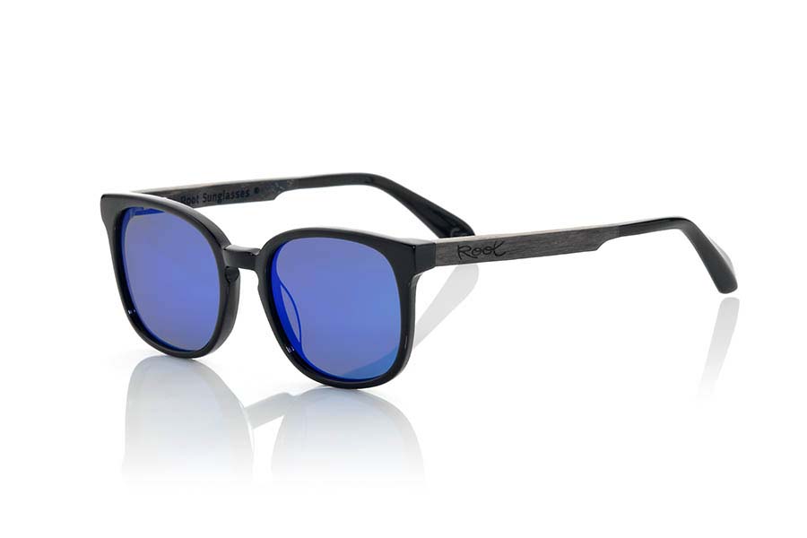 Wood eyewear of Ebony MAUNA. MAUNA sunglasses of the MIXED PREMIUM series are manufactured with the front in acetate quality black and sideburns in natural ebony wood finished in Rod covered in black acetate that can be adjusted if necessary. It is rounded variation of a classic mount, very popular style to the wayfarer combined series with blue REVO or grey lenses. The quality of the materials and their perfect completion will surprise you. Front size: 140x47mm for Wholesale & Retail | Root Sunglasses® 